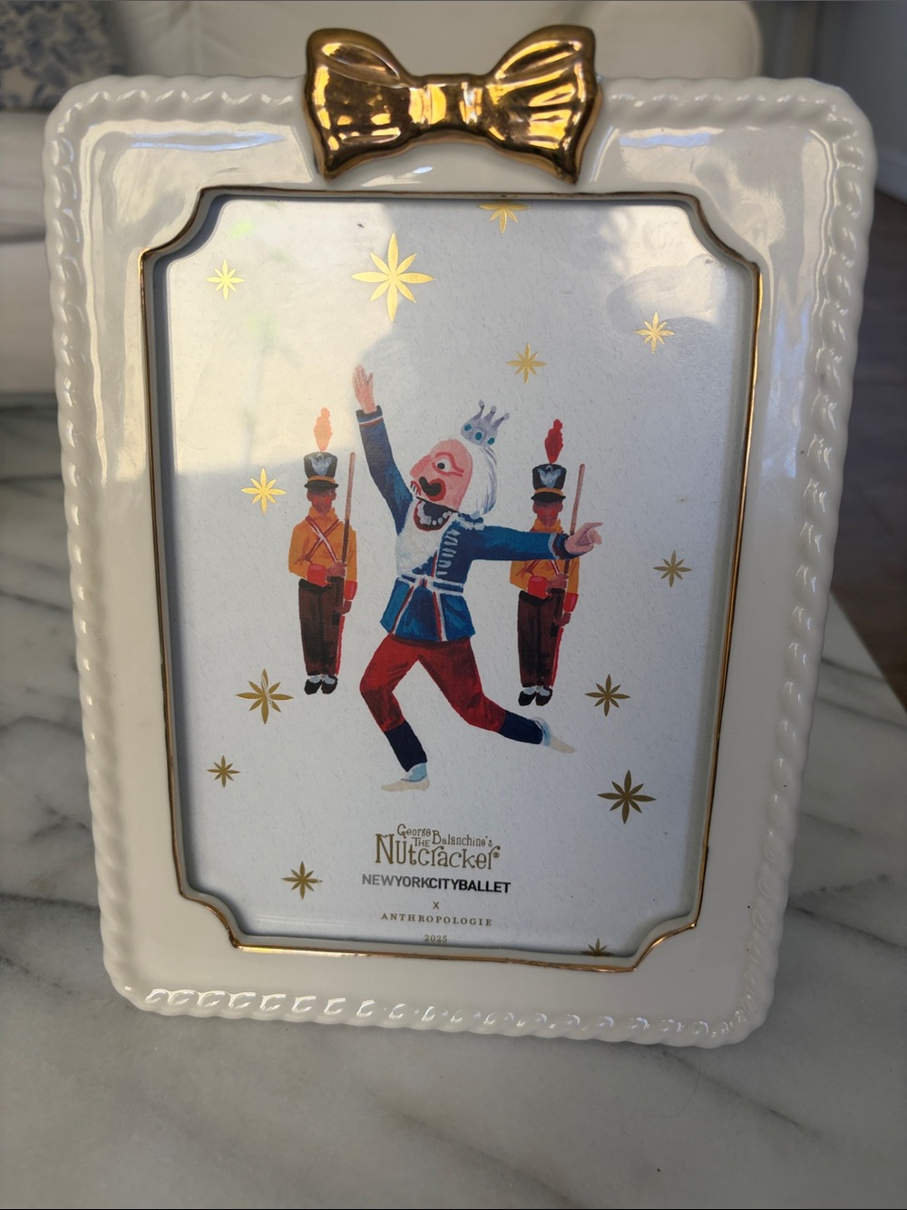 Anthropologie Ceramic Nutcracker picture frame cream, gold Bow and Trim